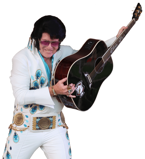 A performer dressed in a classic Elvis Presley-inspired jumpsuit strikes a pose with an acoustic guitar, showcasing vibrant stage charisma.